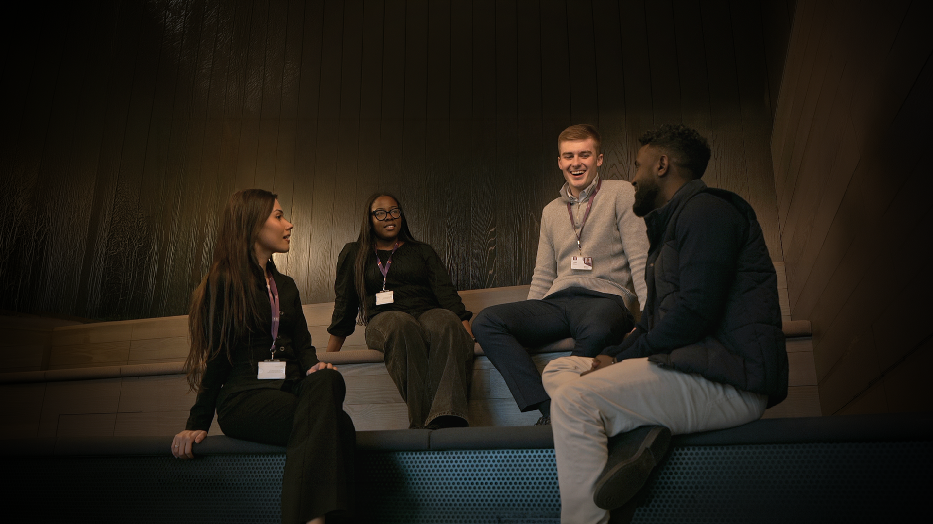 Four graduate students exploring job opportunities with AIB.