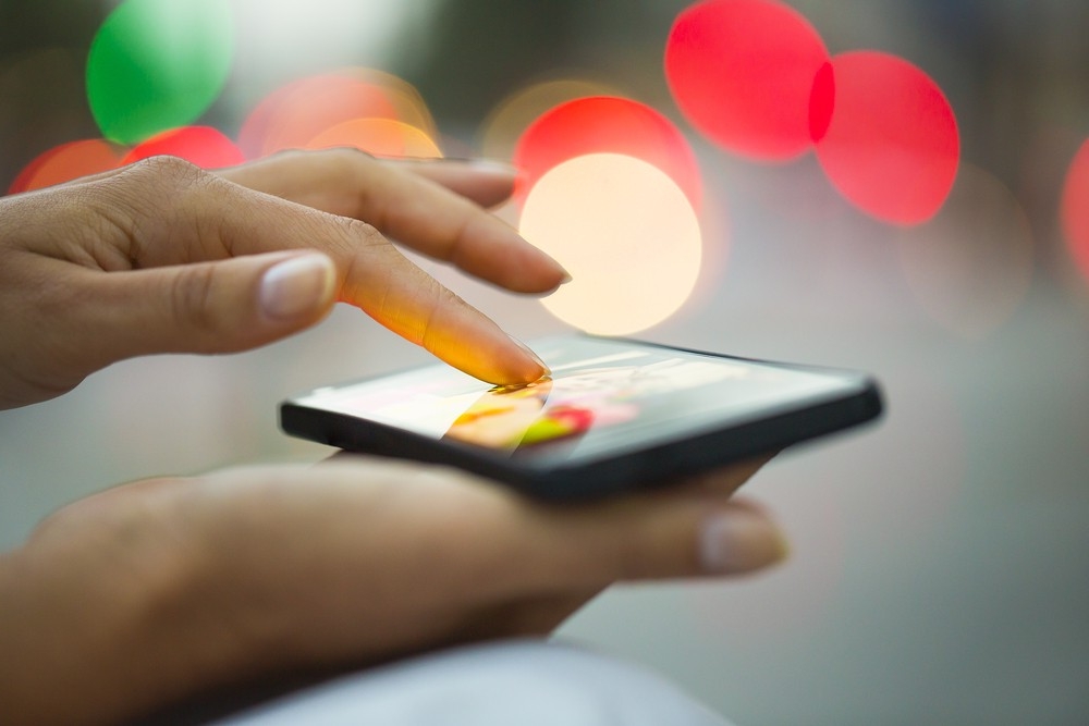 woman holding smartphone