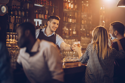 Barman serving drinks